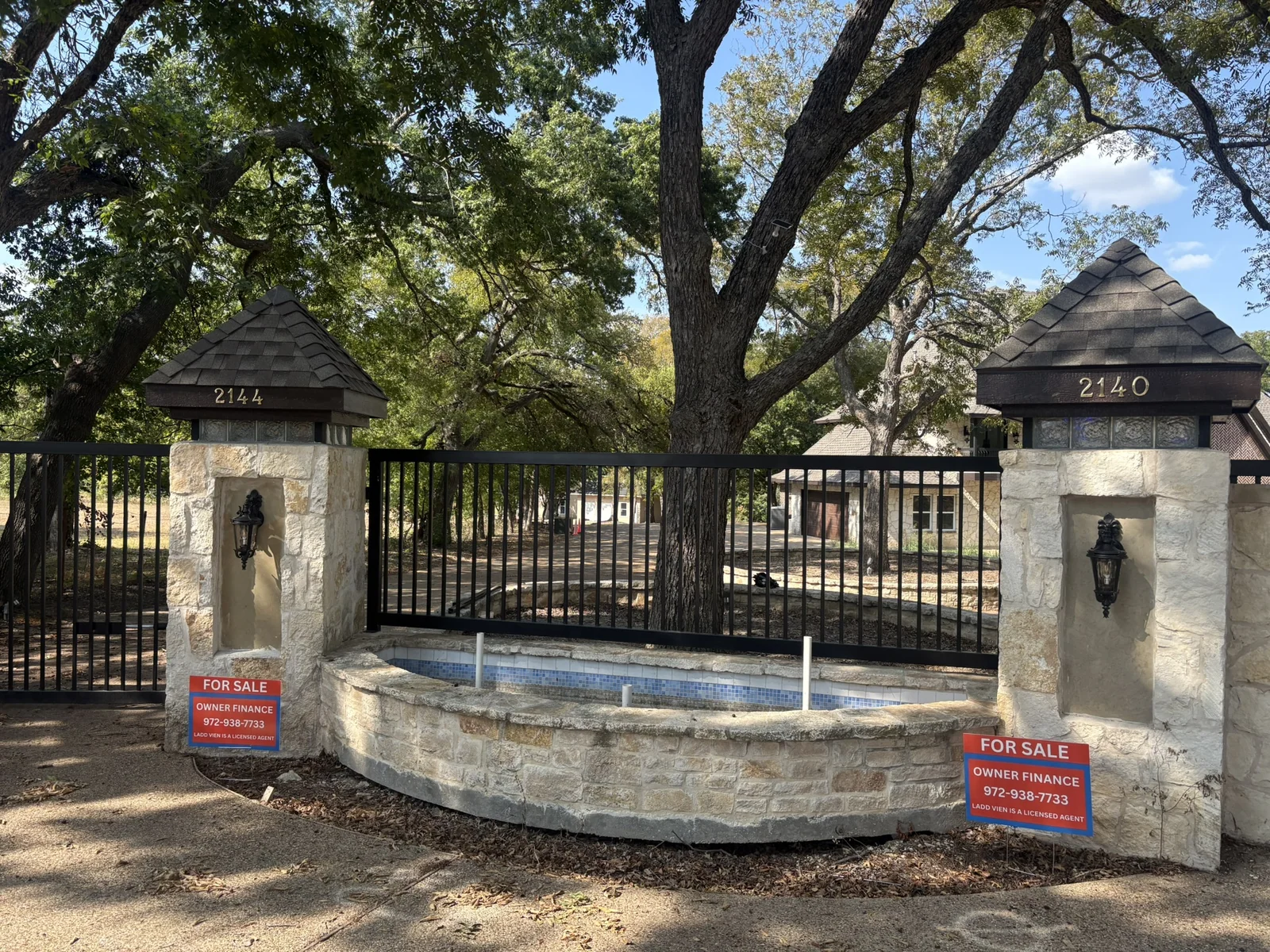 Gated entrance marked 2140 and 2144, 2140 Bells Chapel Road - September 2026