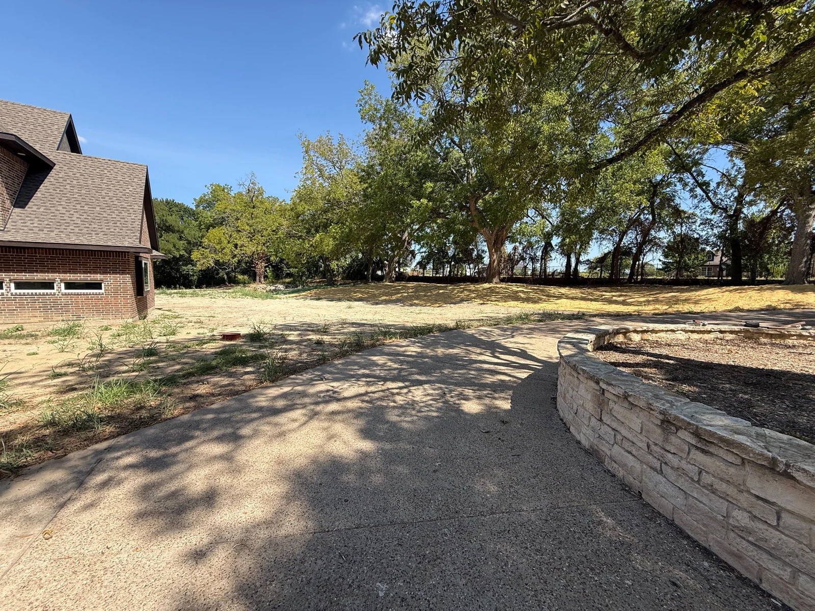 Trees and grounds beside the main residence, 2140 Bells Chapel Road - September 2026 / MLS